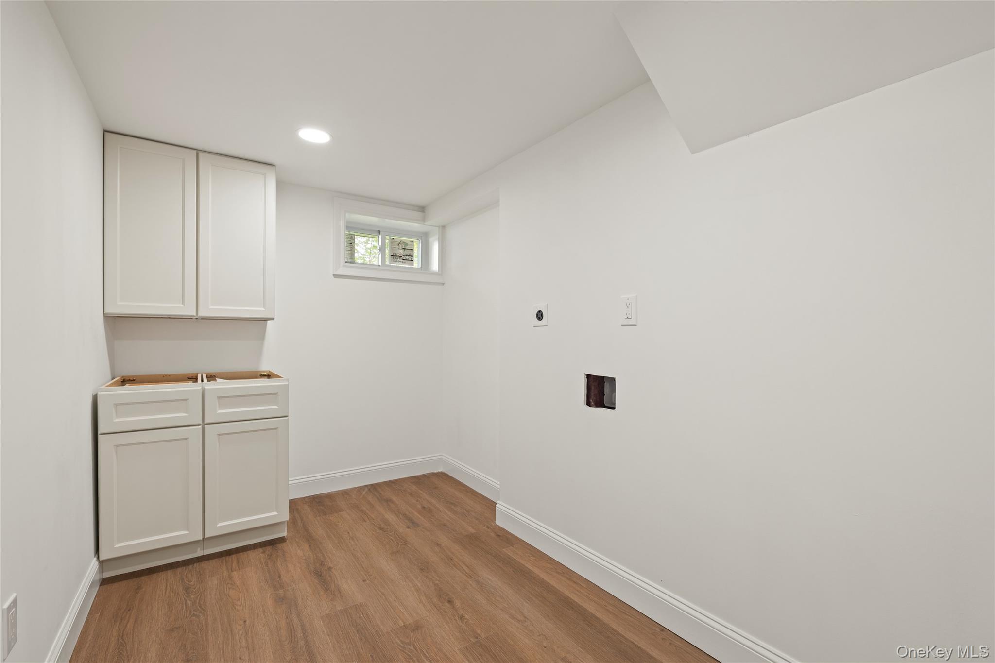 16 Eleanor Road Plainview, NY 11803 - Photo 21 of 28 Finished basement with wood-finish flooring, and recessed ceiling lighting