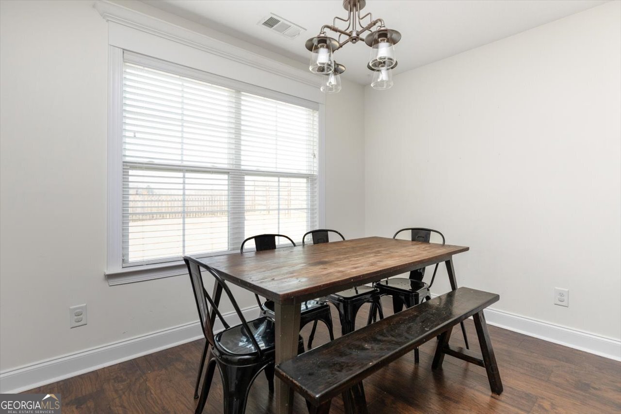 207 Kendall Court Perry, GA 31069 - Photo 12 of 45 a view of a dining room with furniture window and wooden floor