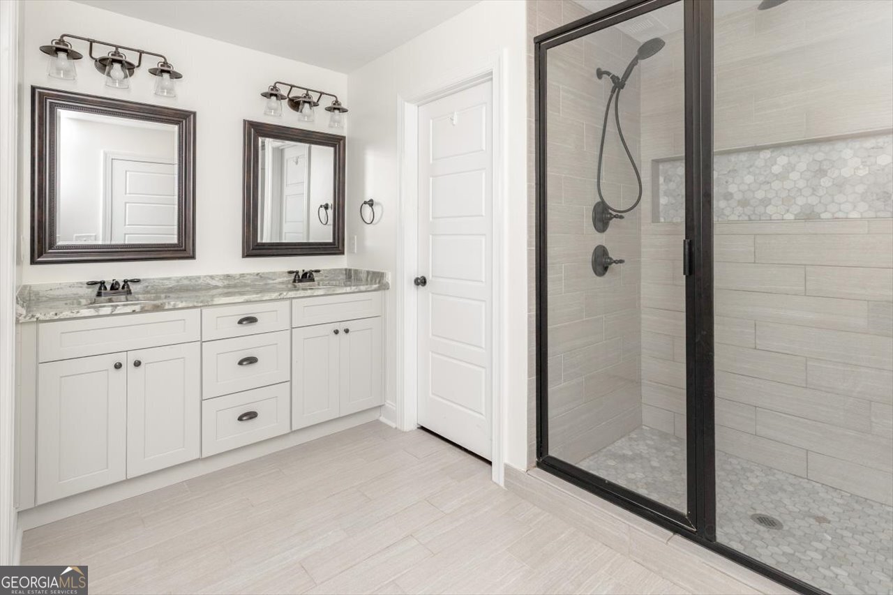 207 Kendall Court Perry, GA 31069 - Photo 27 of 45 a spacious bathroom with a double vanity sink mirror and double