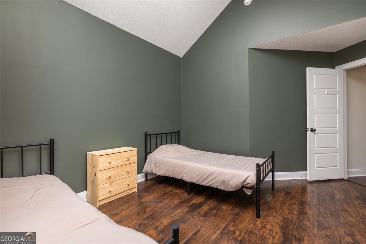 207 Kendall Court Perry, GA 31069 - Photo 35 of 45 a bedroom with bed and wooden floor