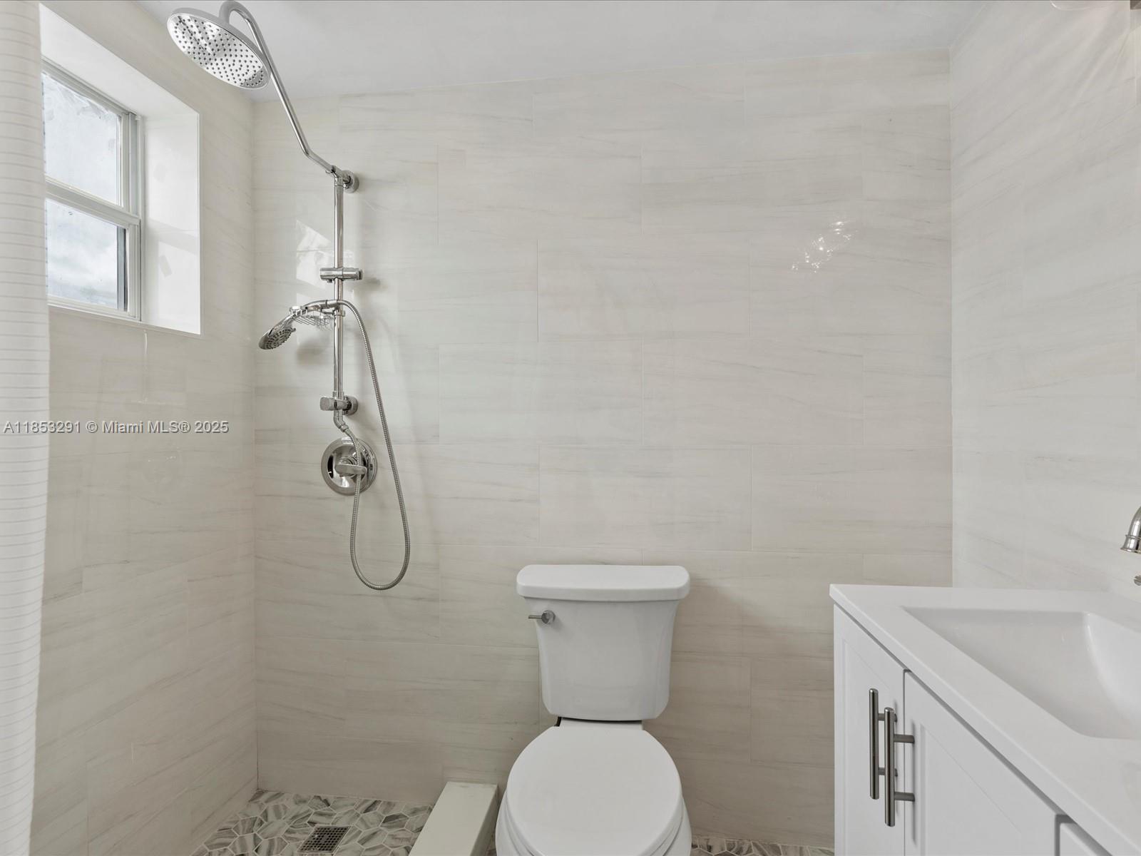 200 Northeast 12th Avenue, Unit 7C Hallandale Beach, FL 33009 - Photo 12 of 27 a bathroom with a toilet and a sink