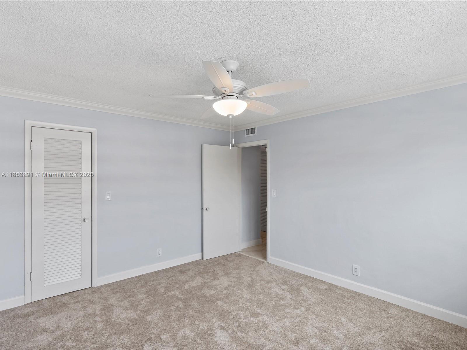 200 Northeast 12th Avenue, Unit 7C Hallandale Beach, FL 33009 - Photo 13 of 27 an empty room with a ceiling fan and a window