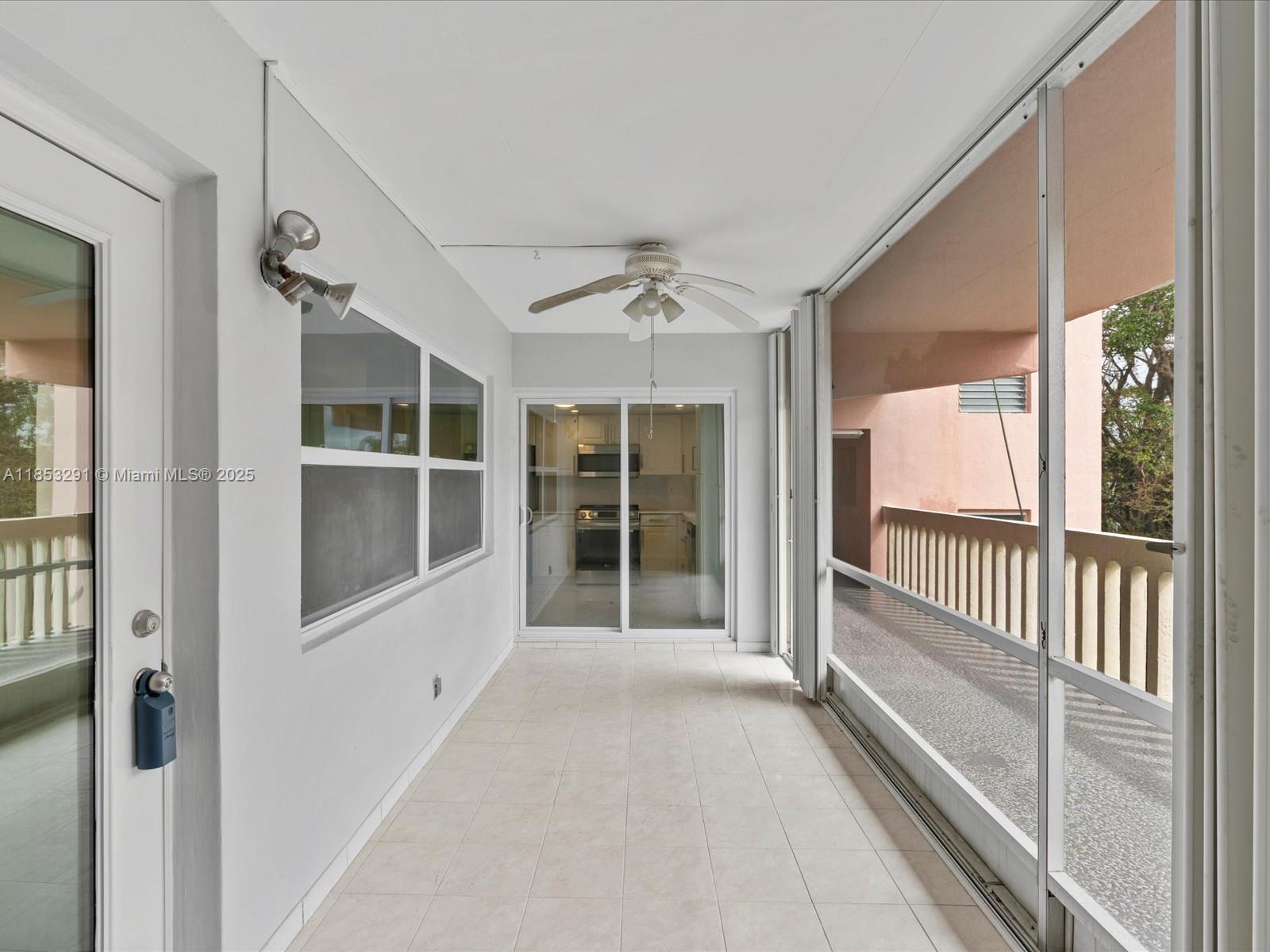 200 Northeast 12th Avenue, Unit 7C Hallandale Beach, FL 33009 - Photo 17 of 27 workspace with wooden floor and windows