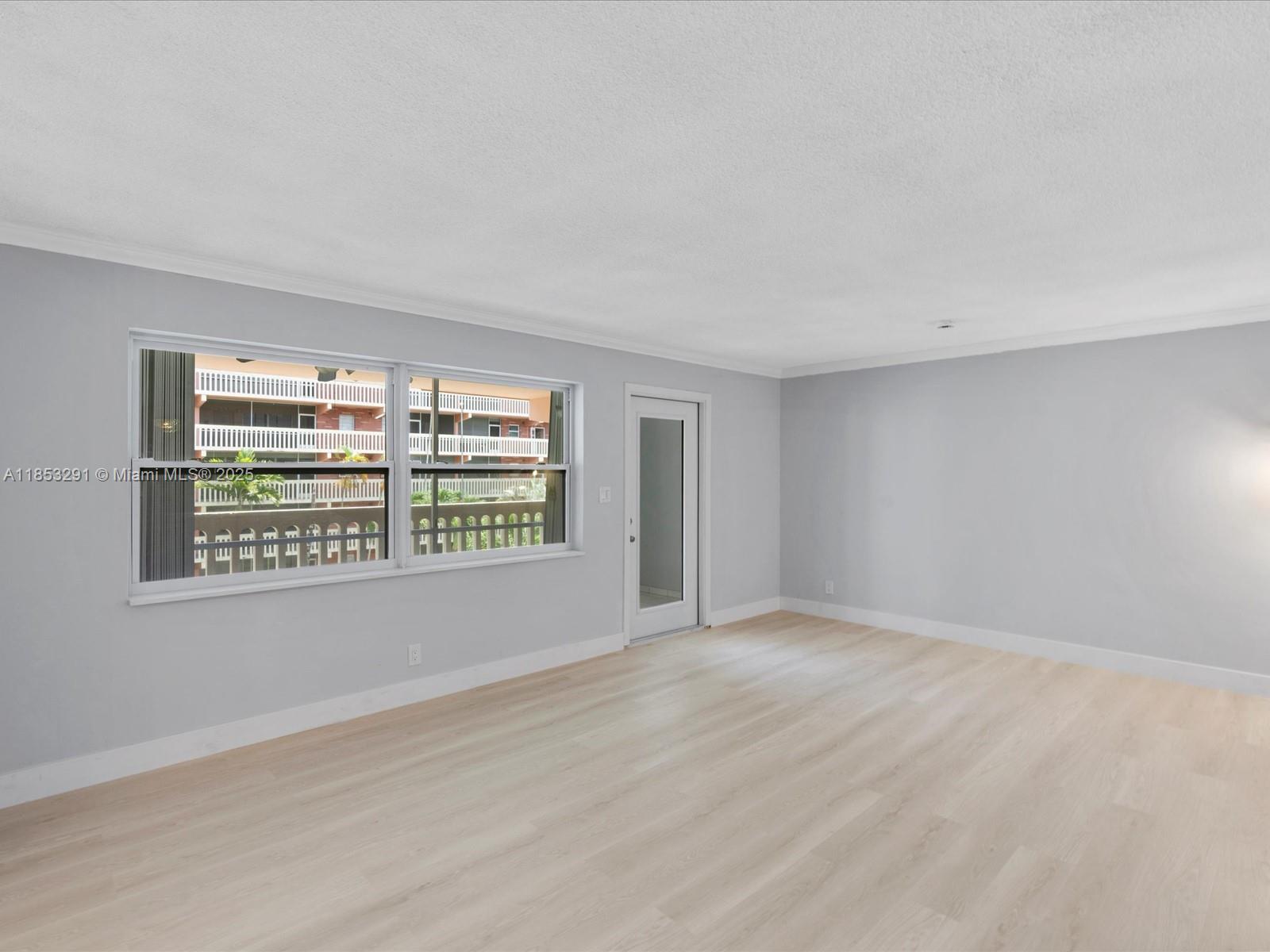 200 Northeast 12th Avenue, Unit 7C Hallandale Beach, FL 33009 - Photo 7 of 27 a view of an empty room with a window