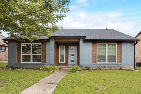 front view of a house with a yard