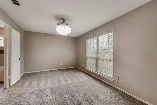 an empty room with a empty space and a window