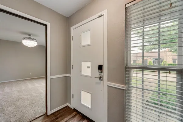 a view of wooden floor and windows in a room