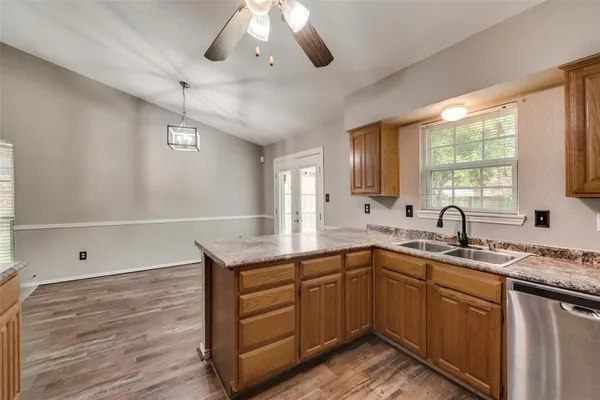 a kitchen with a sink stove and cabinets