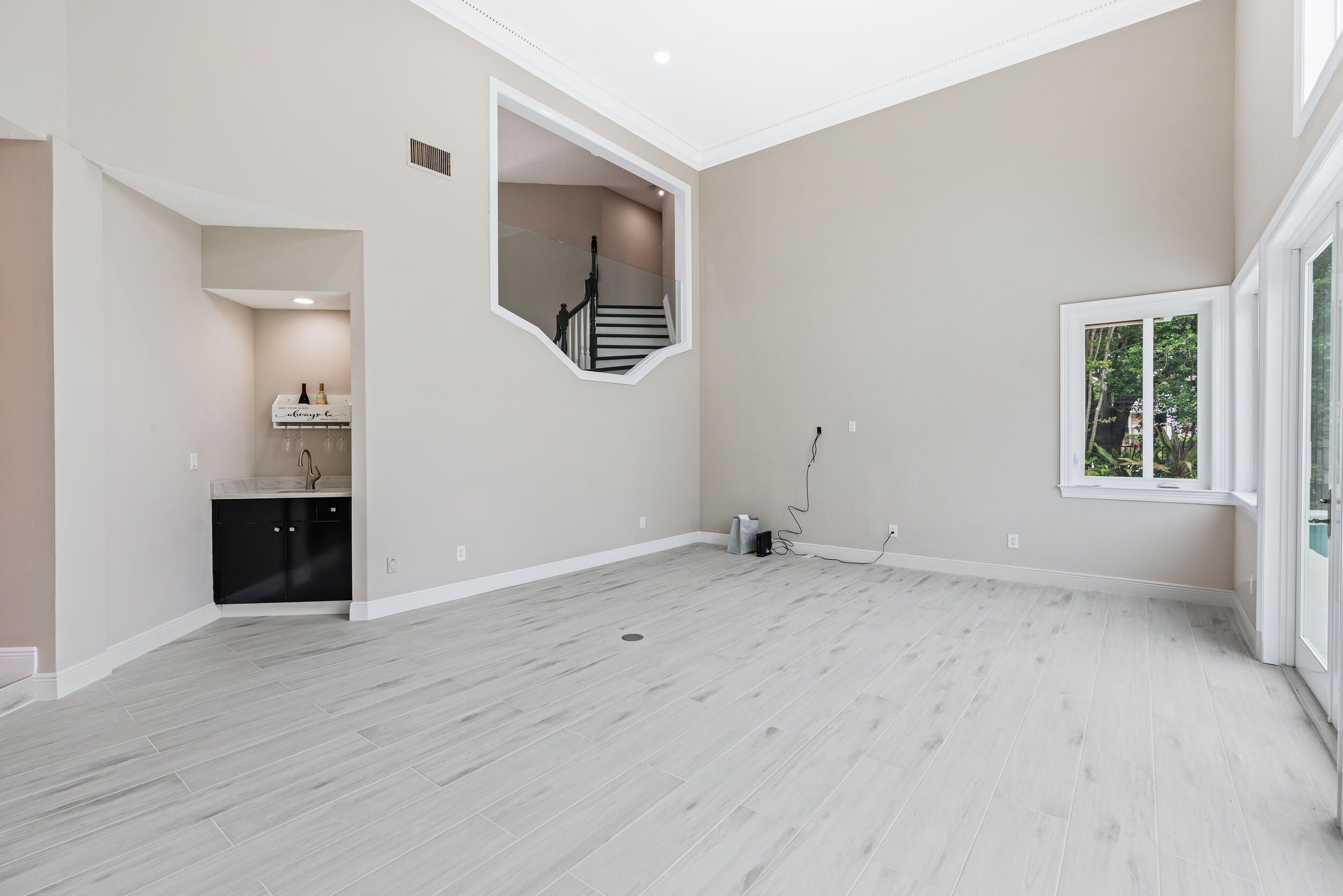 18169 Southeast Ridgeview Drive Tequesta, FL 33469 - Photo 16 of 51 wooden floor in an empty room