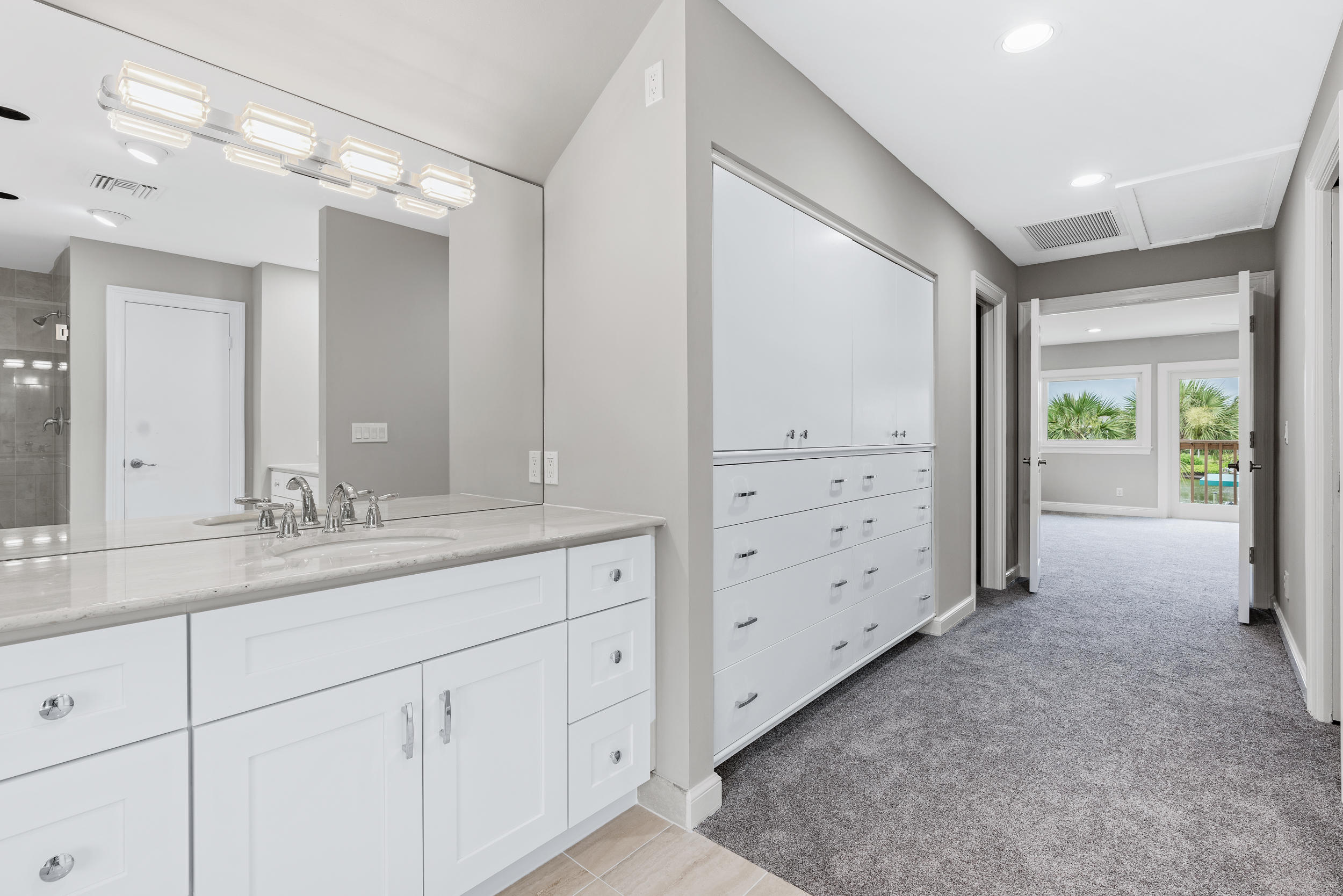 18169 Southeast Ridgeview Drive Tequesta, FL 33469 - Photo 26 of 51 a bathroom with a granite countertop sink mirror and