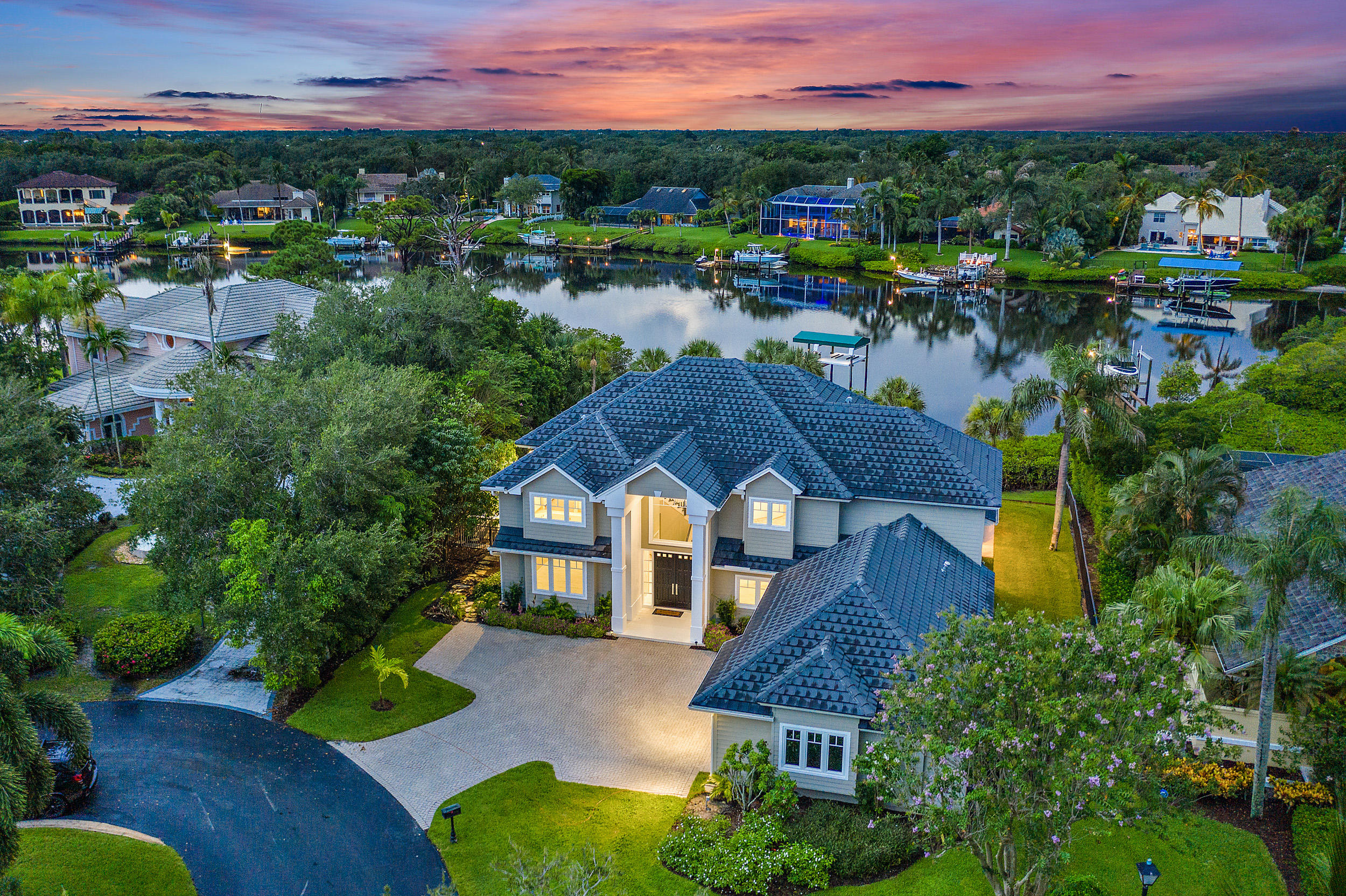 18169 Southeast Ridgeview Drive Tequesta, FL 33469 - Photo 4 of 51 a aerial view of a house with a garden and lake view