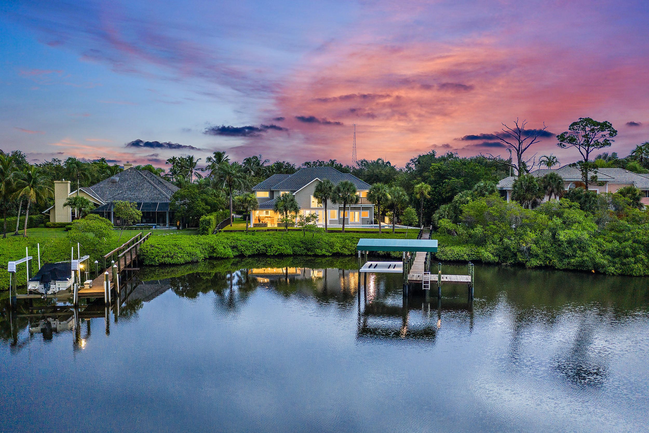 18169 Southeast Ridgeview Drive Tequesta, FL 33469 - Photo 46 of 51 a view of a lake with a table chairs and a lake view