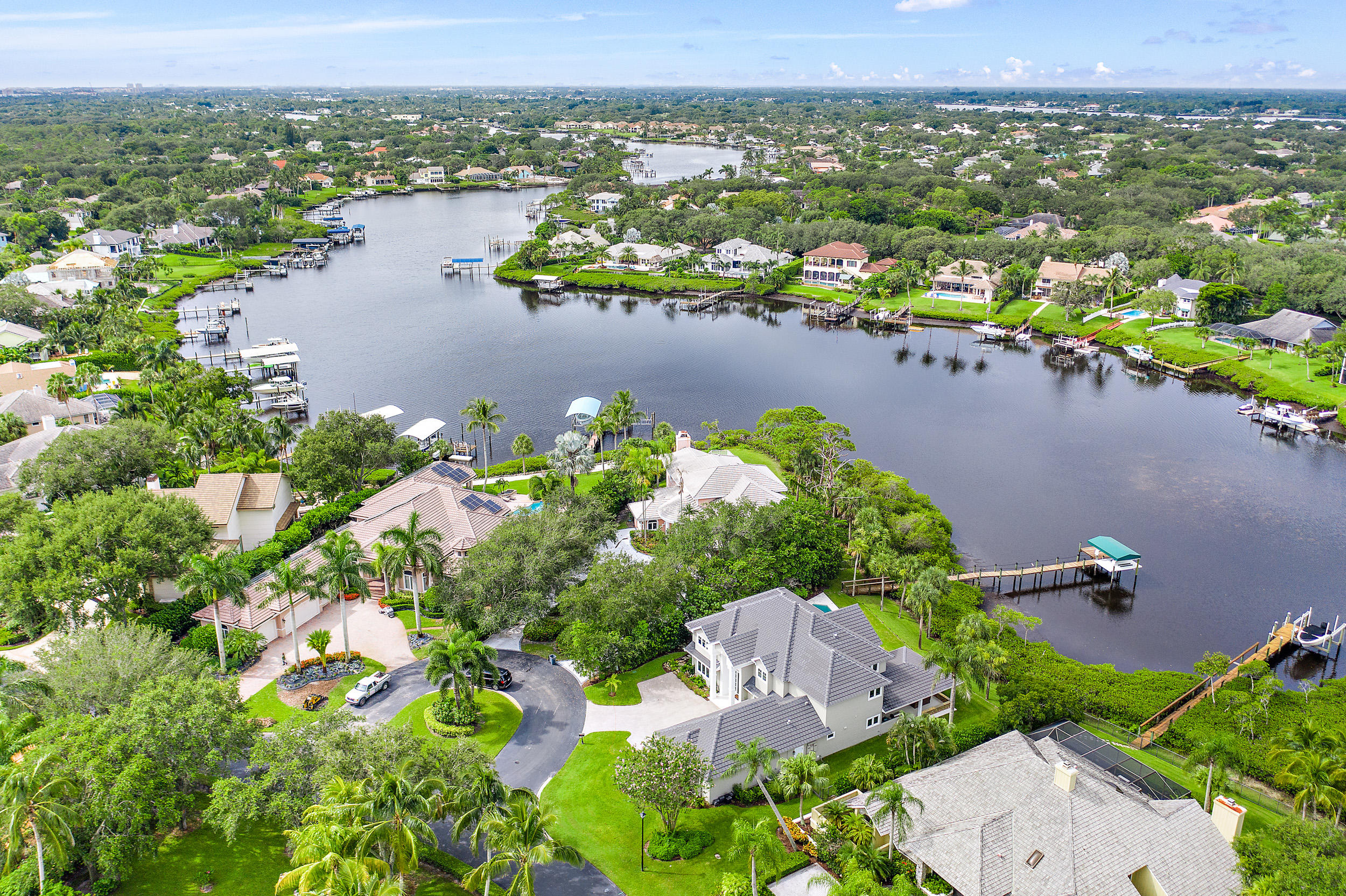 18169 Southeast Ridgeview Drive Tequesta, FL 33469 - Photo 47 of 51 an aerial view of a houses with a lake view