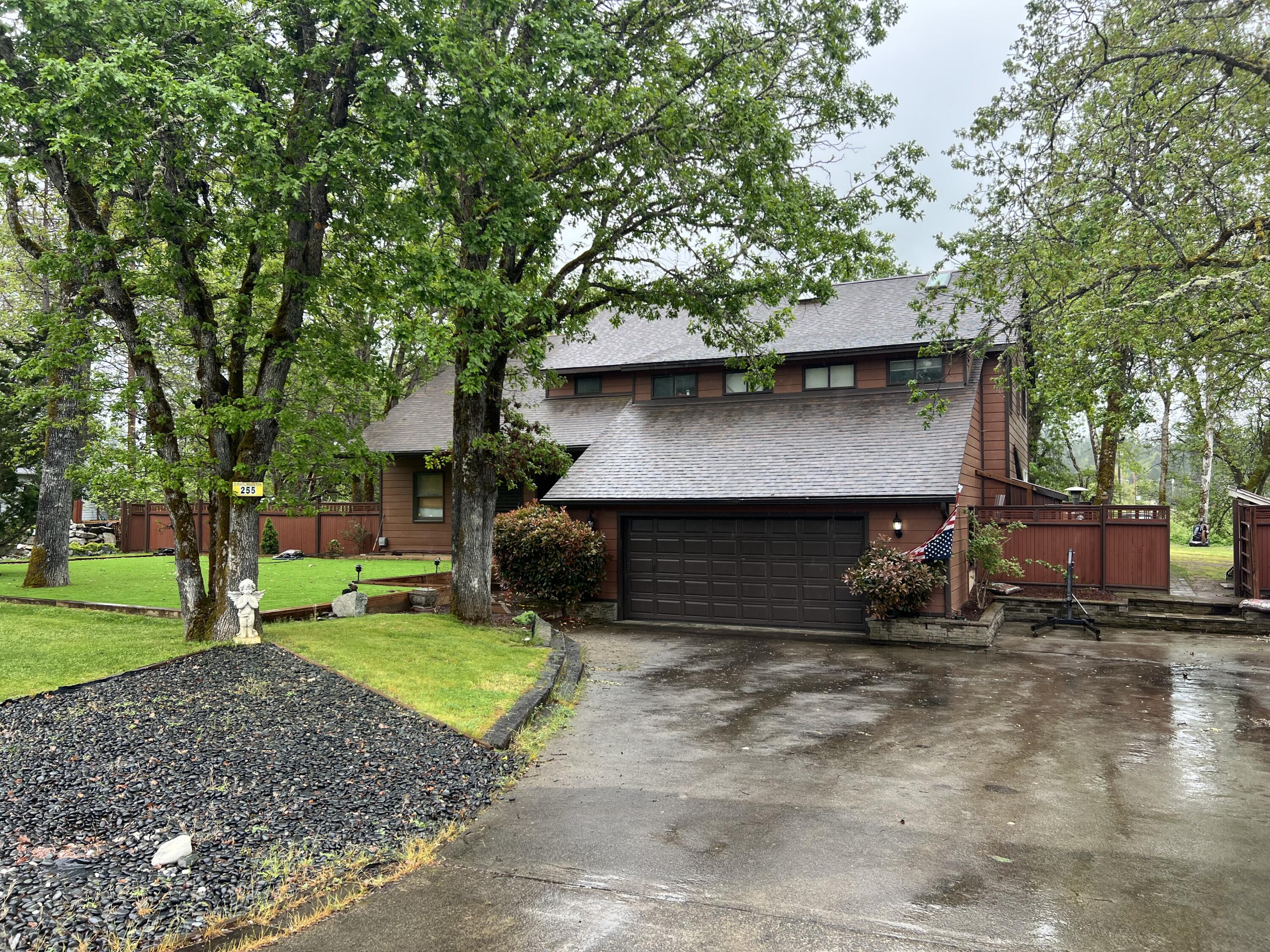 255 Barker Drive Merlin, OR 97532 - Photo 3 of 26 a view of a house with backyard and a tree