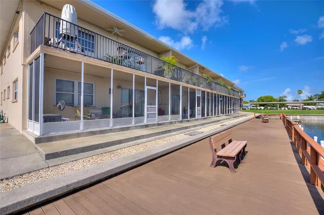 a view of swimming pool with outdoor seating