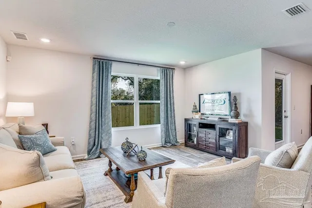 a living room with furniture and a window
