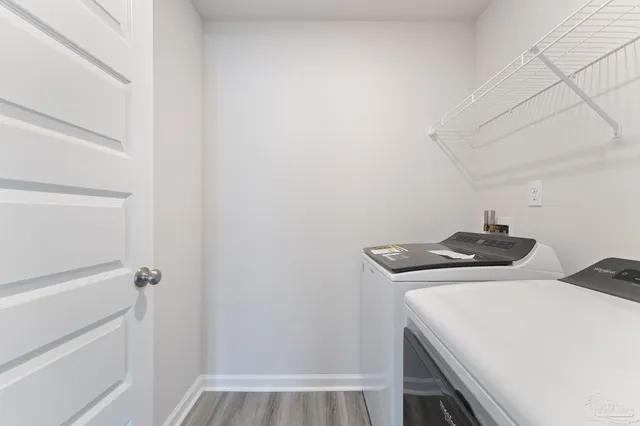 a utility room with dryer and washer