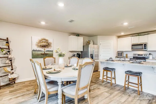 a view of a dining room with furniture