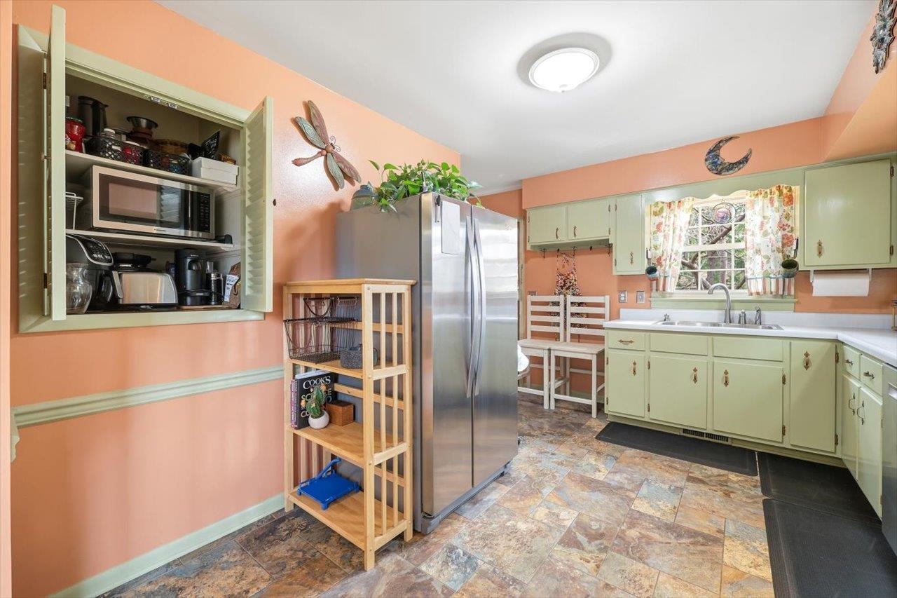 408 Robin Street Staunton, VA 24401 - Photo 11 of 52 a kitchen with a refrigerator and a sink
