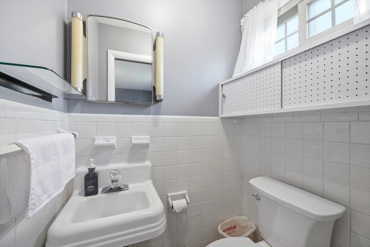 408 Robin Street Staunton, VA 24401 - Photo 16 of 52 a bathroom with a toilet sink and mirror