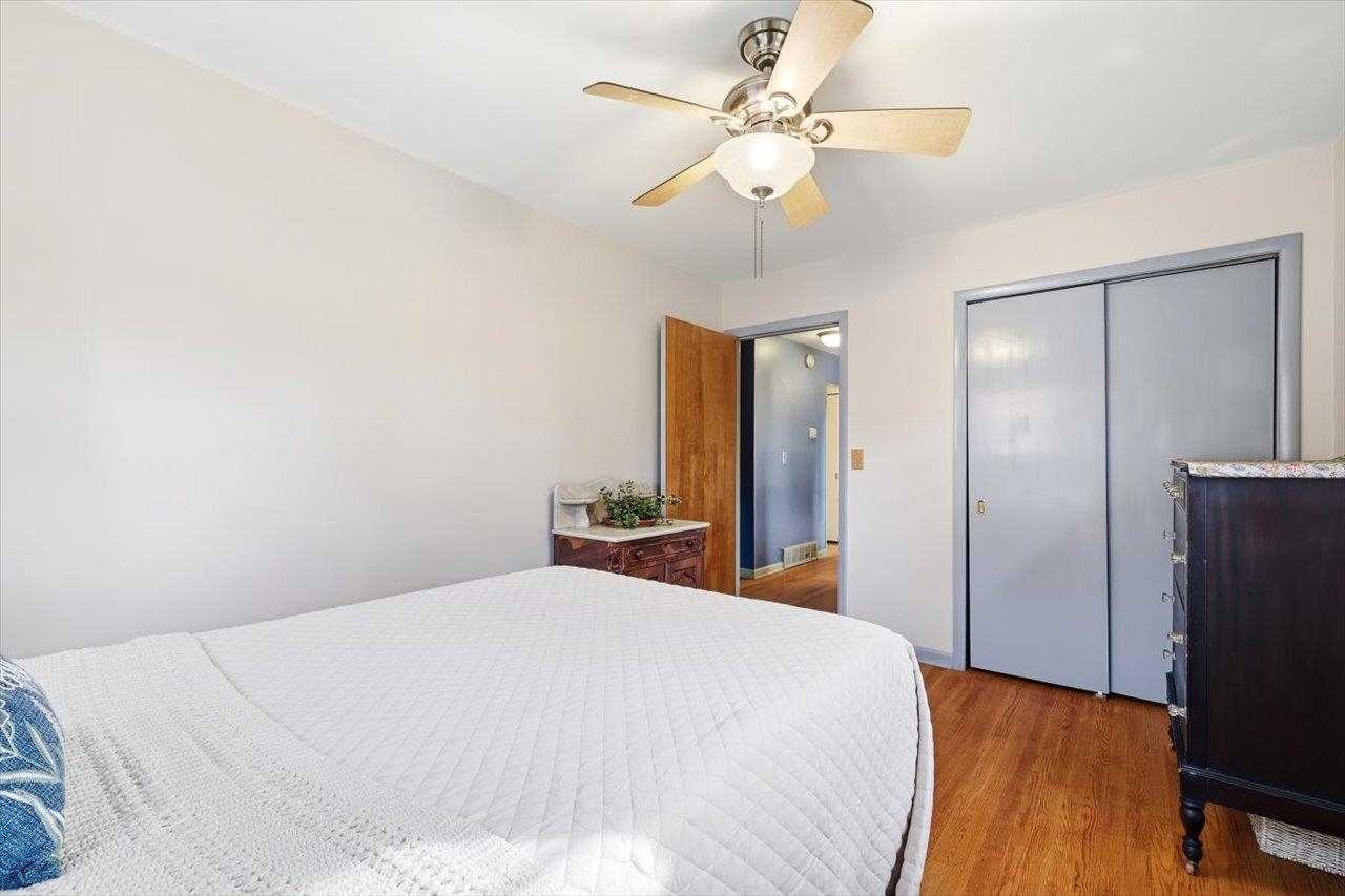 408 Robin Street Staunton, VA 24401 - Photo 17 of 52 a bedroom with a bed and a chandelier