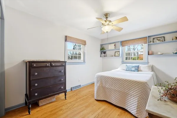 a bedroom with a large bed and a window