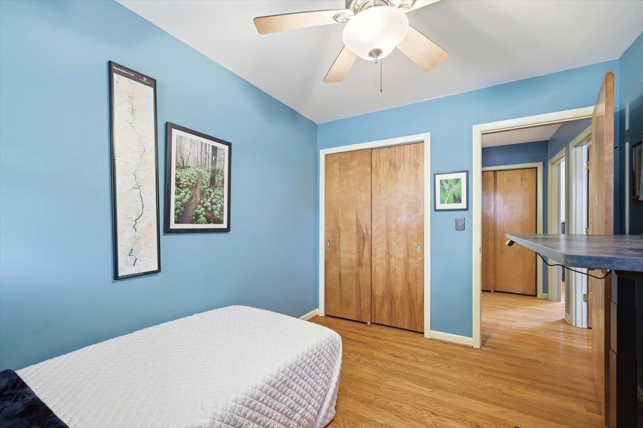 408 Robin Street Staunton, VA 24401 - Photo 20 of 52 a bedroom with a bed and a chandelier