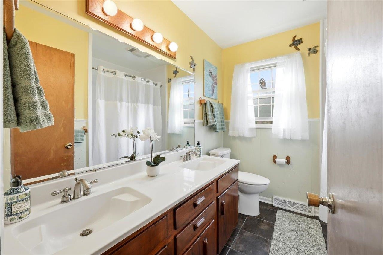 408 Robin Street Staunton, VA 24401 - Photo 22 of 52 a bathroom with a sink double vanity and a mirror