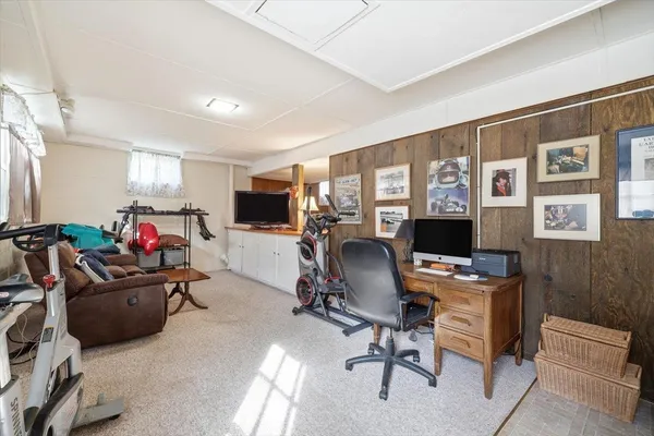 a bathroom with a sink and mirror with toilet