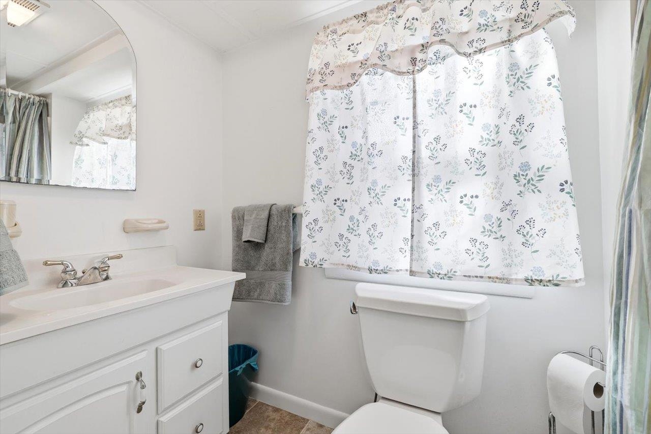 408 Robin Street Staunton, VA 24401 - Photo 29 of 52 a bathroom with a sink and mirror with toilet