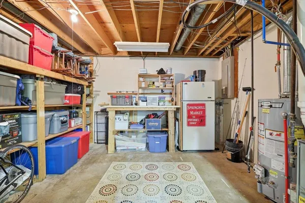 a view of a house with a yard and plants