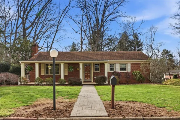 a view of a porch with furniture and garden