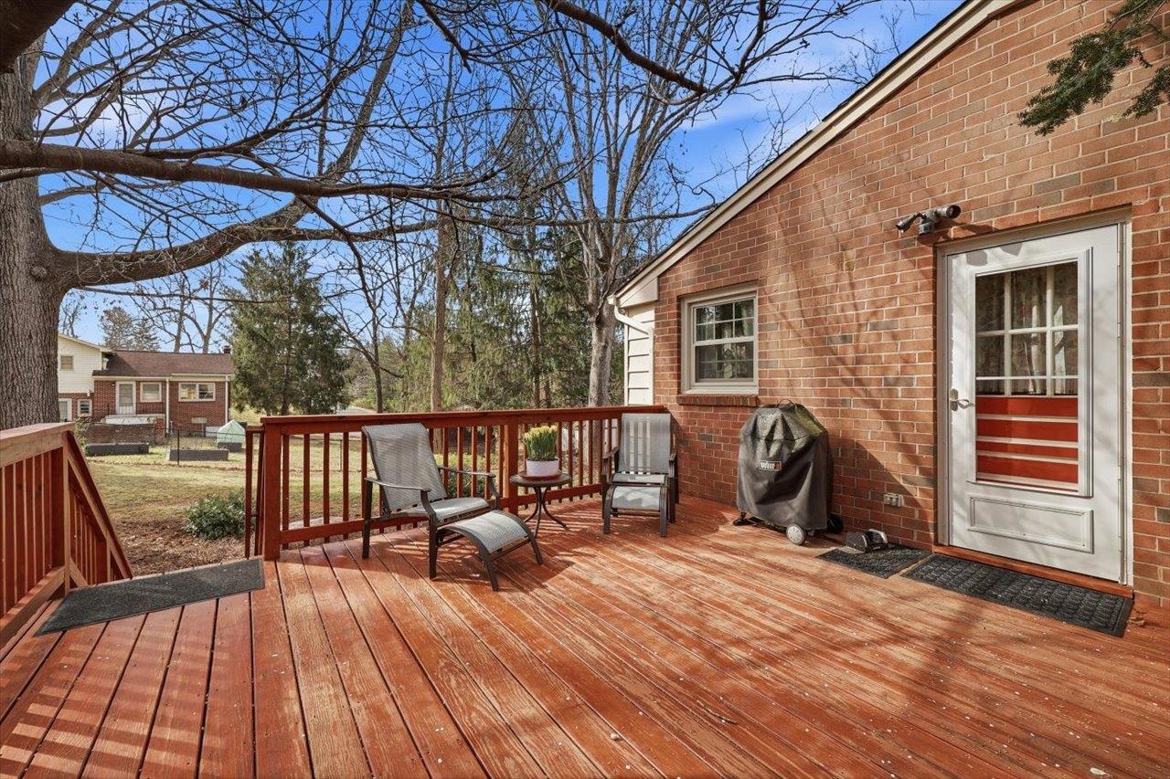 408 Robin Street Staunton, VA 24401 - Photo 37 of 52 a view of a balcony with chairs and wooden floor