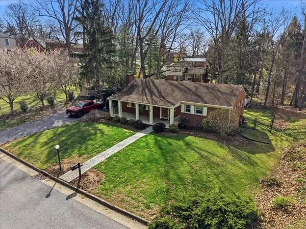 a view of house with yard