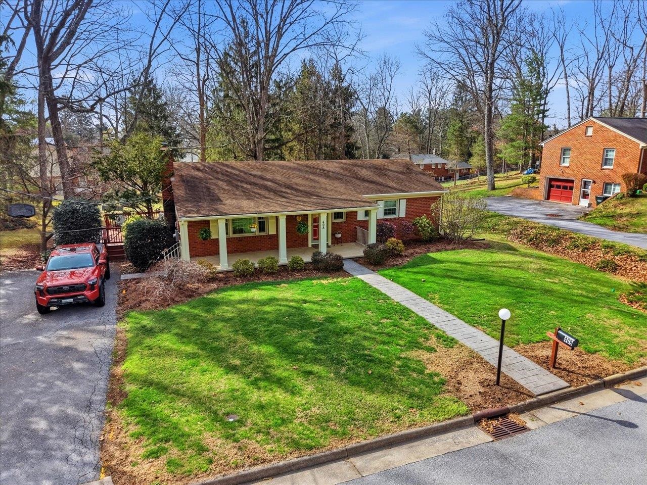 408 Robin Street Staunton, VA 24401 - Photo 46 of 52 a front view of a house with garden