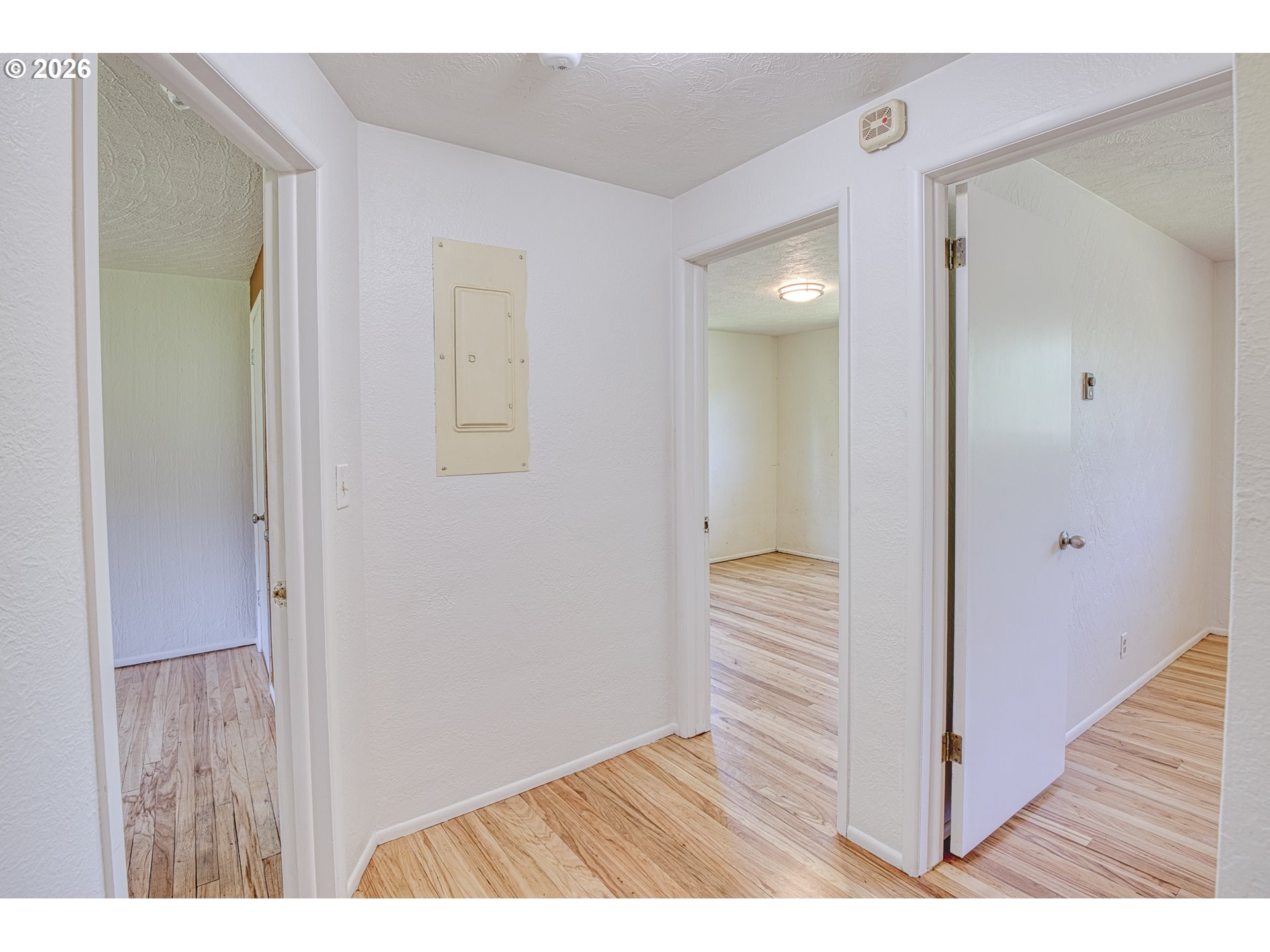 7077 Main Street Springfield, OR 97478 - Photo 14 of 34 a view of an empty room with wooden floor