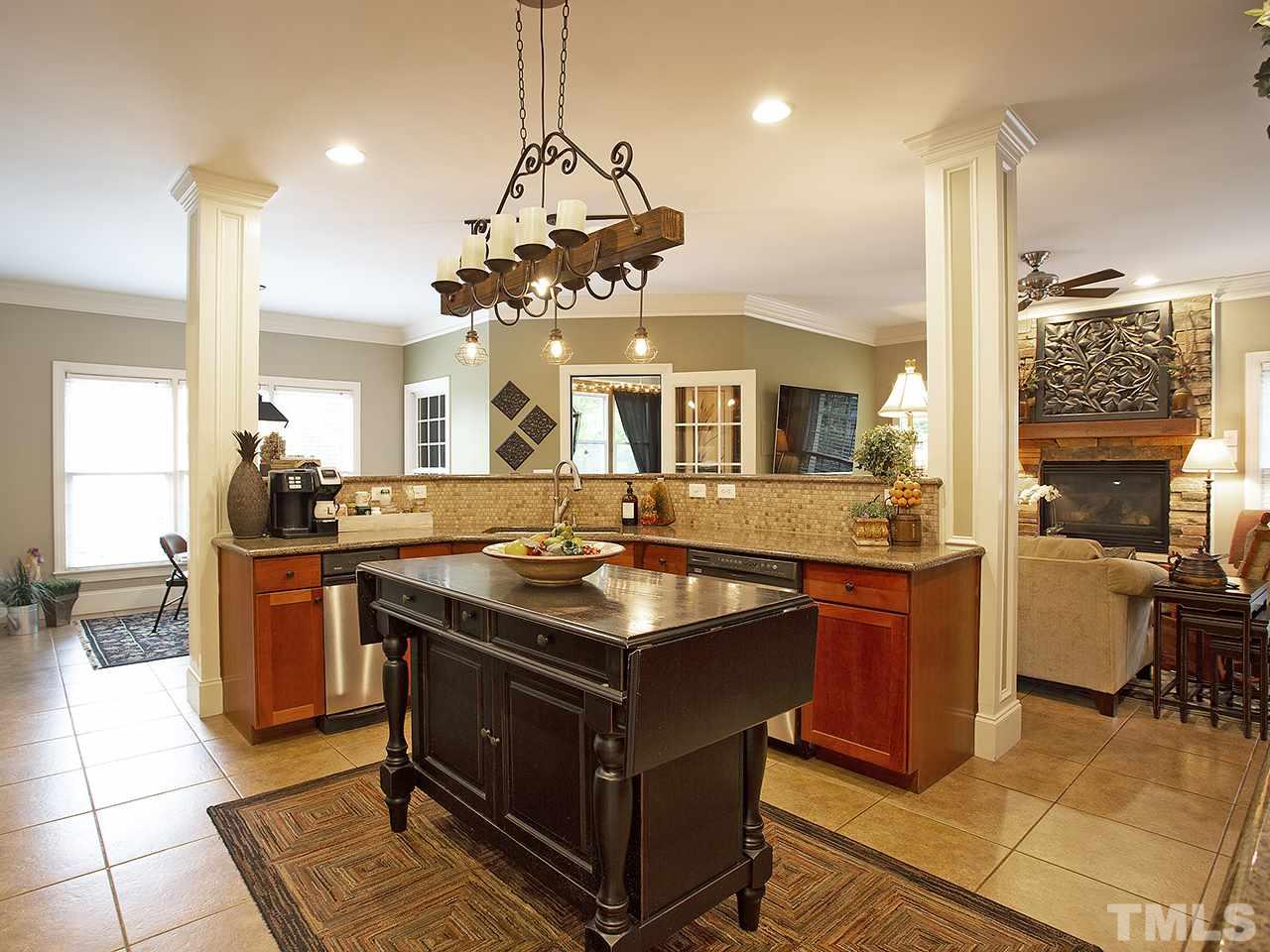 7304 Sparhawk Road Wake Forest, NC 27587 - Photo 13 of 30 Granite counter tops, center island and wet bar. All open to breakfast and gathering area.