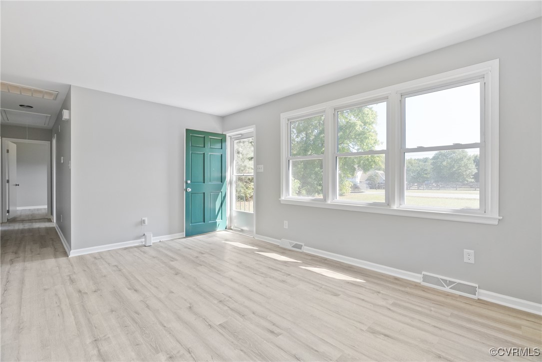 14830 Nash Road Chesterfield, VA 23838 - Photo 8 of 30 a view of an empty room with wooden floor and a window
