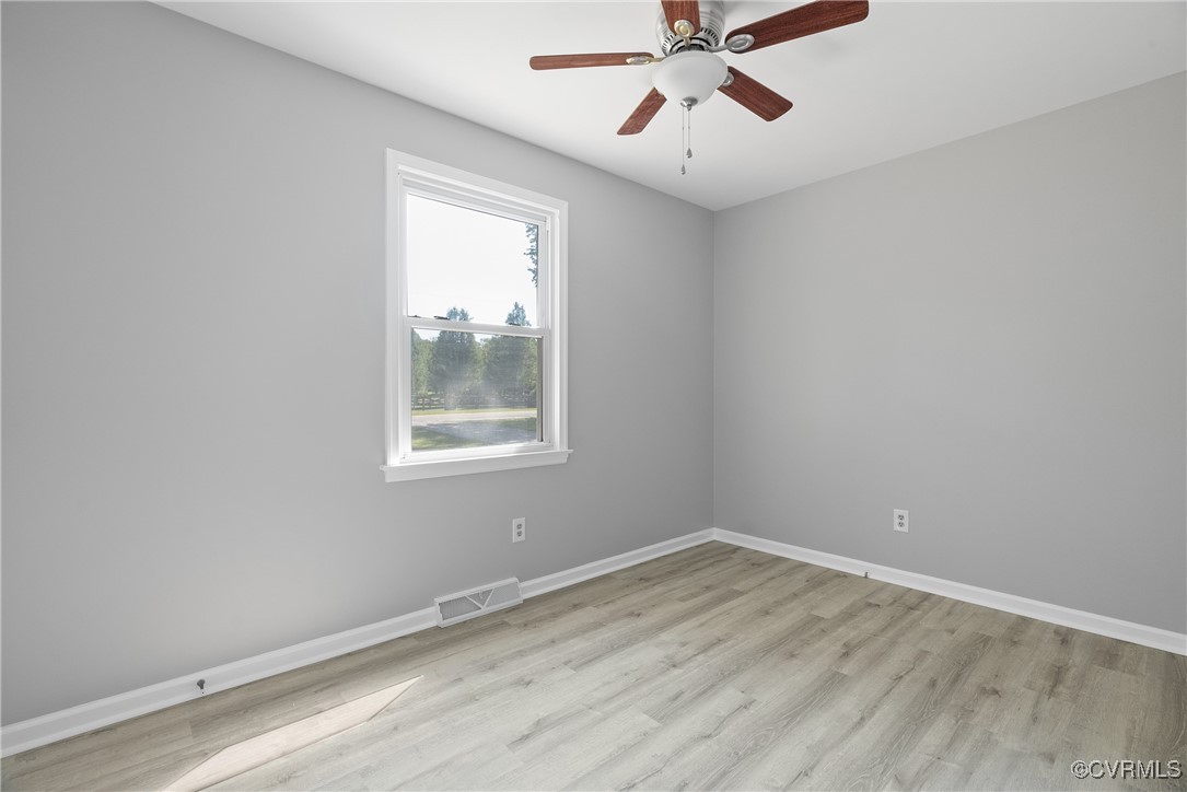 14830 Nash Road Chesterfield, VA 23838 - Photo 9 of 30 wooden floor in an empty room with a window
