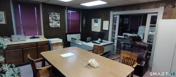 a view of table and chairs in kitchen