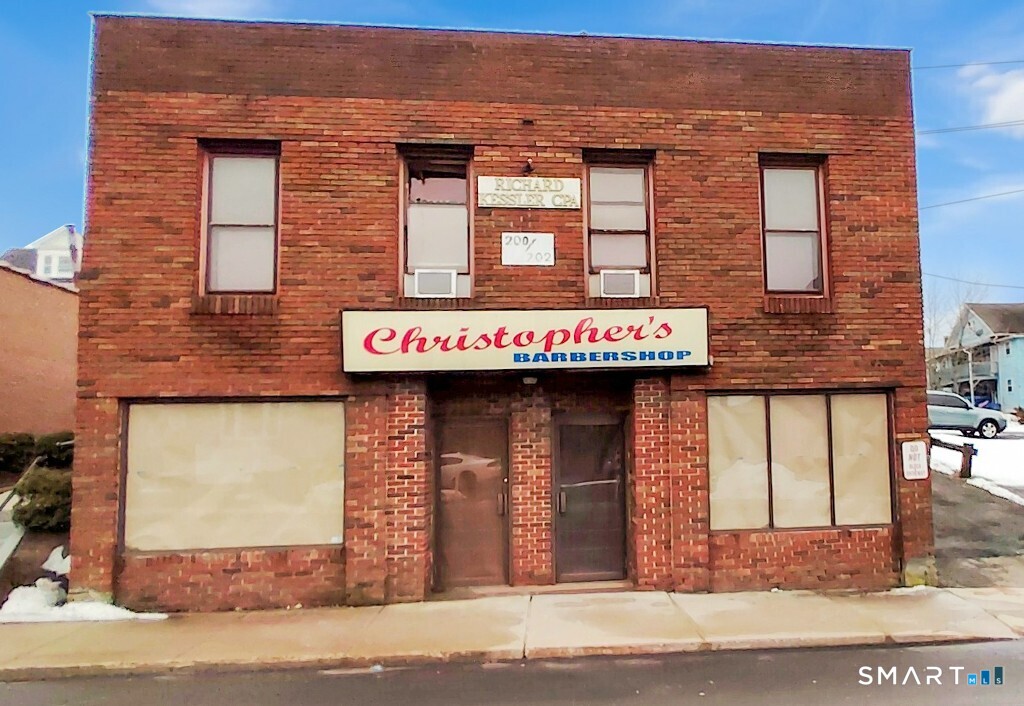 200 West Main Street Meriden, CT 06451 - Photo 2 of 53 a front view of a building with granite countertop lots of windows