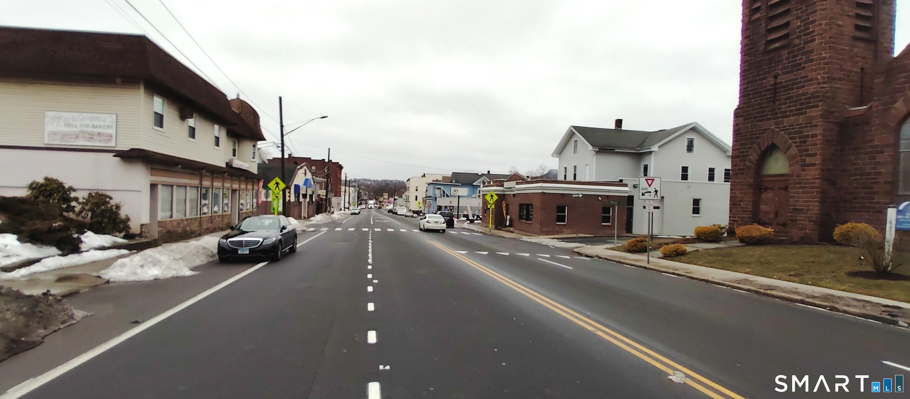 200 West Main Street Meriden, CT 06451 - Photo 30 of 53 a view of a city street with tall buildings