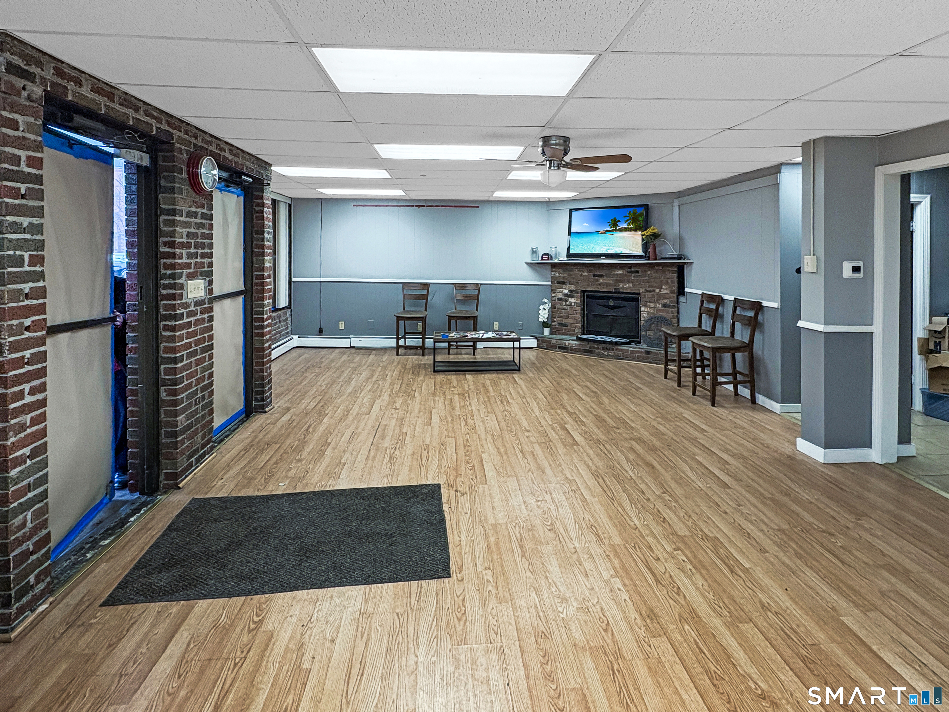 200 West Main Street Meriden, CT 06451 - Photo 3 of 53 a room with wooden floors and lots of chairs