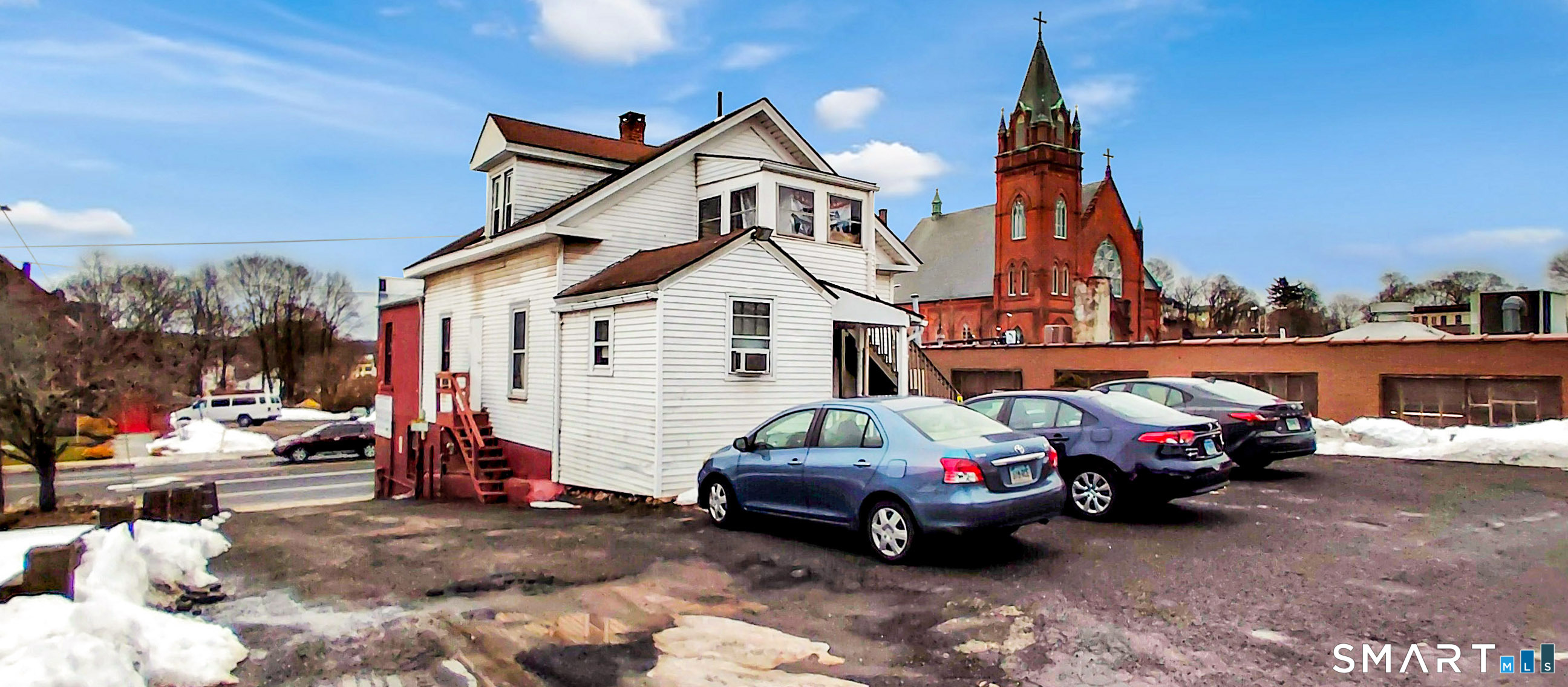 200 West Main Street Meriden, CT 06451 - Photo 36 of 53 a car parked in front of a house
