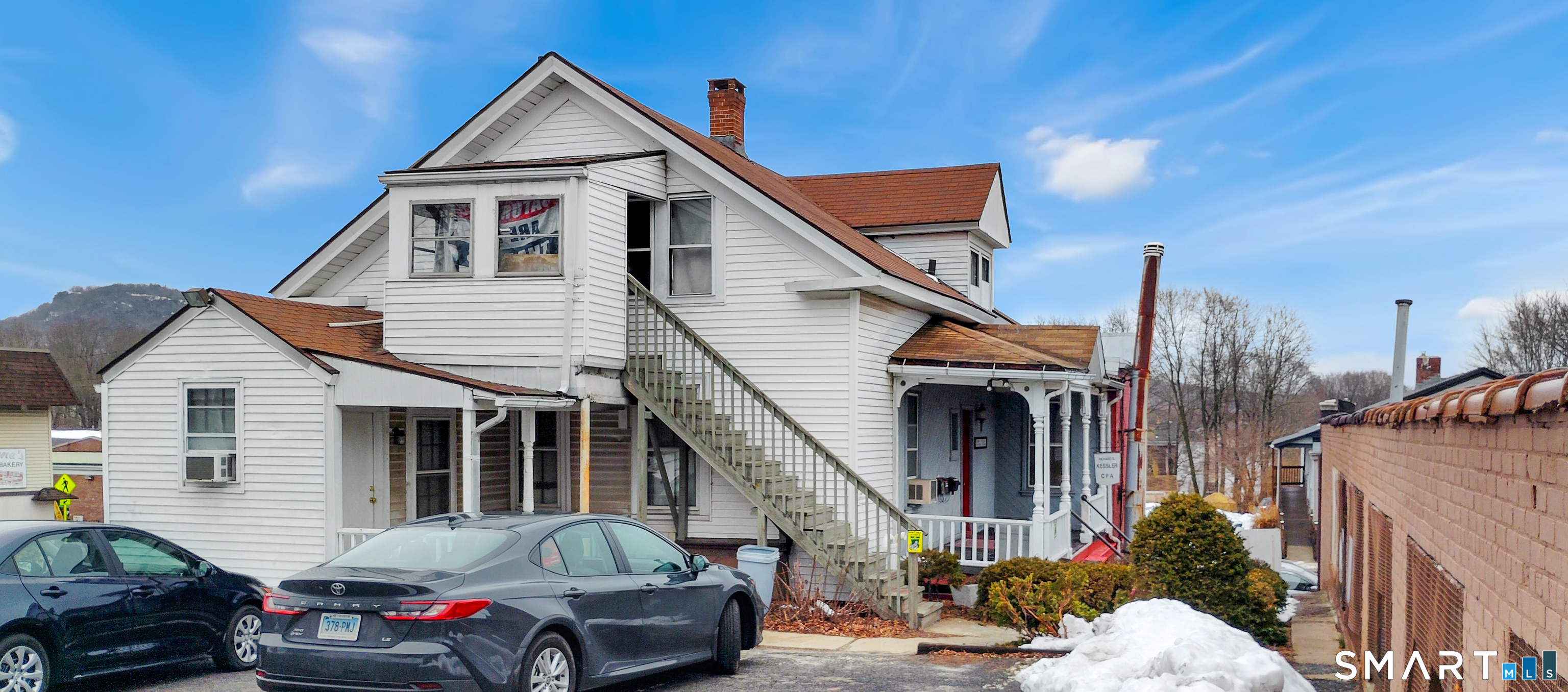 200 West Main Street Meriden, CT 06451 - Photo 37 of 53 a front view of a house with parking space