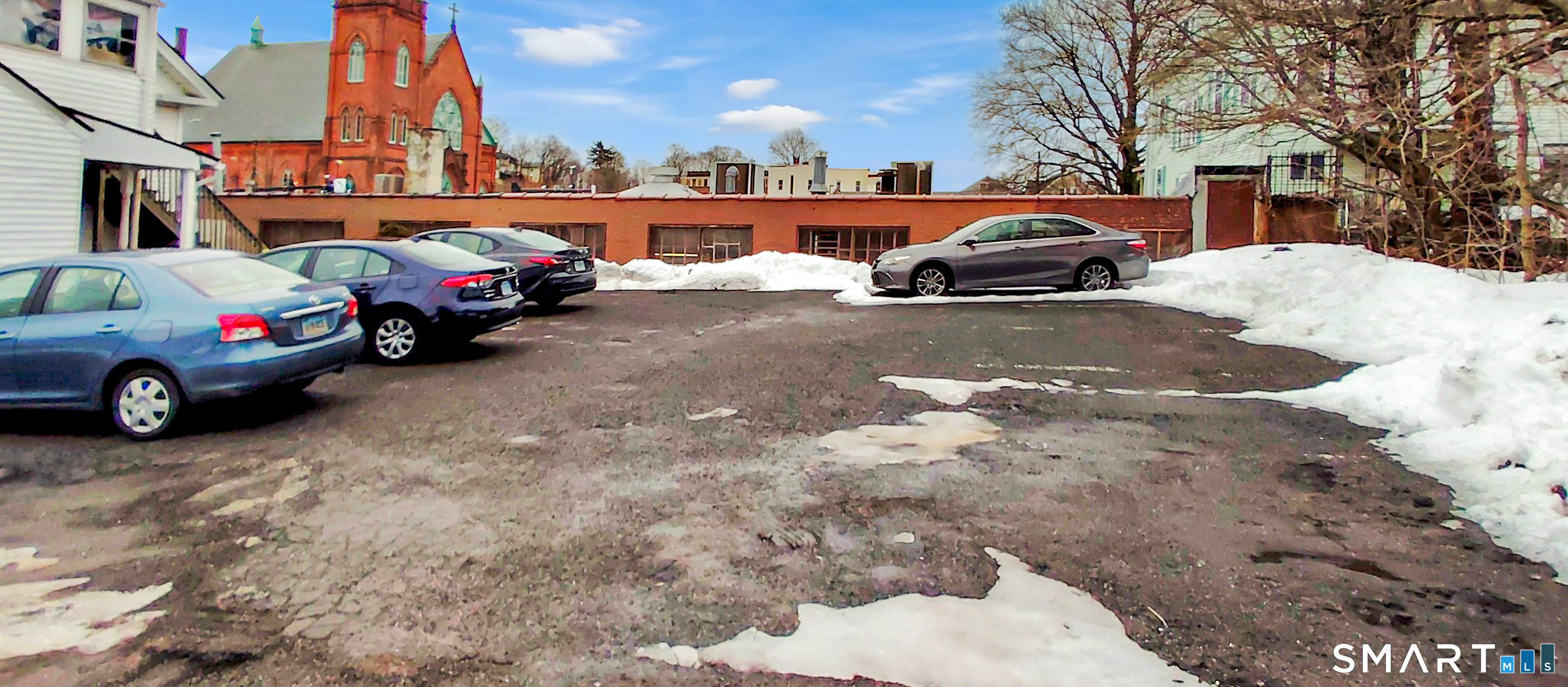 200 West Main Street Meriden, CT 06451 - Photo 39 of 53 a view of a cars park in front of a house