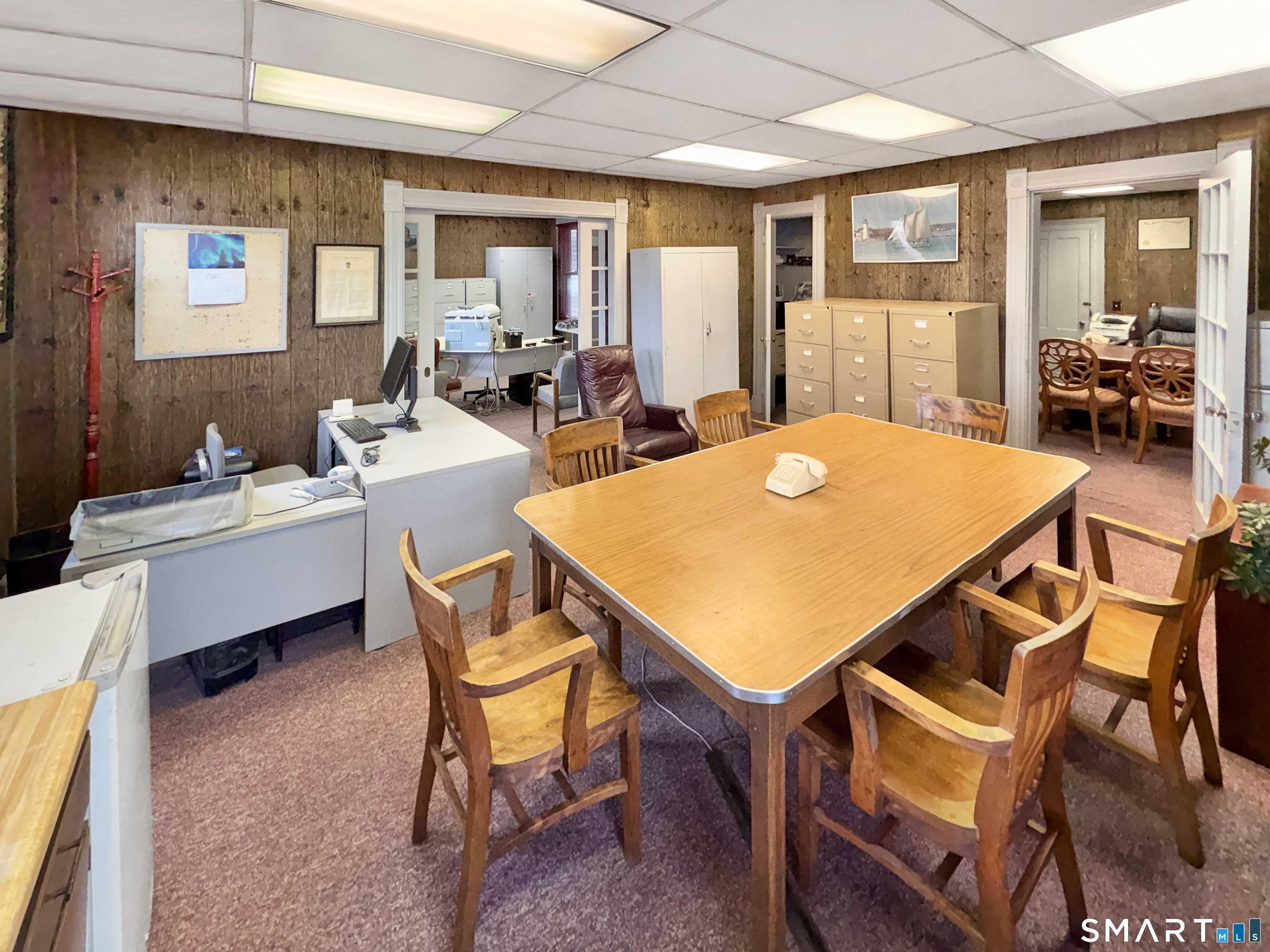 200 West Main Street Meriden, CT 06451 - Photo 48 of 53 a dining room with a table chairs and a open kitchen view