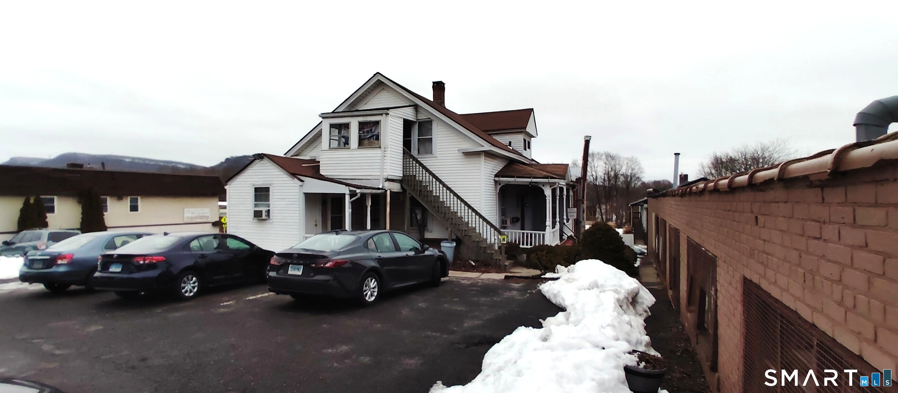 200 West Main Street Meriden, CT 06451 - Photo 49 of 53 a car parked in front of a house