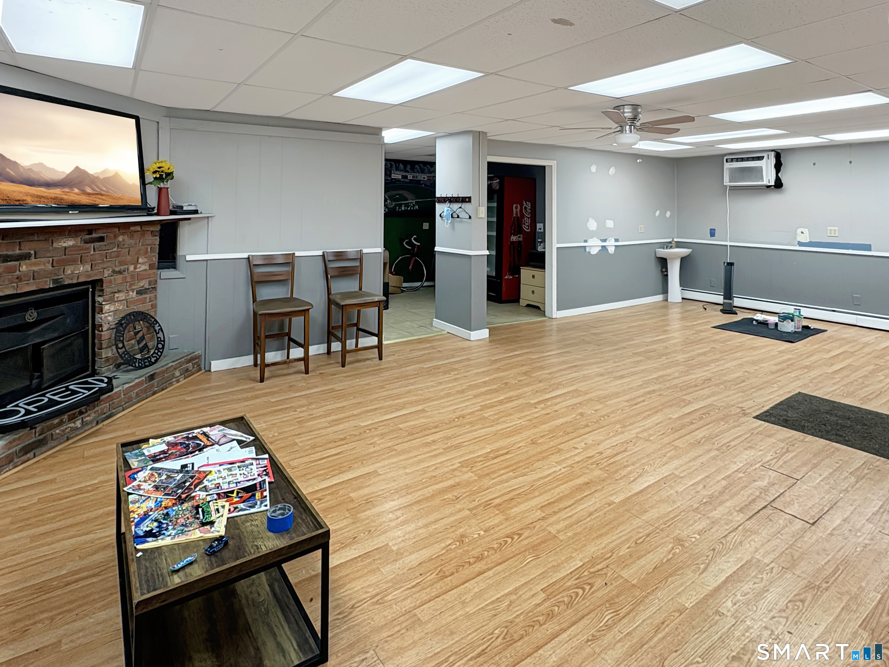 200 West Main Street Meriden, CT 06451 - Photo 5 of 53 a living room with stainless steel appliances furniture a fireplace and a flat screen tv