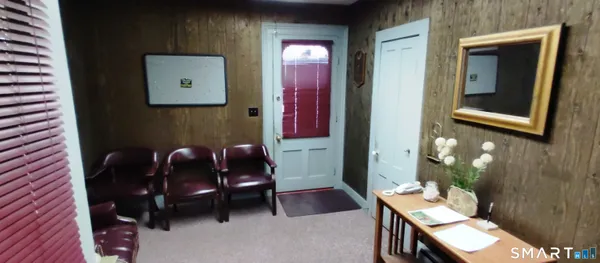 a room with furniture and a chair